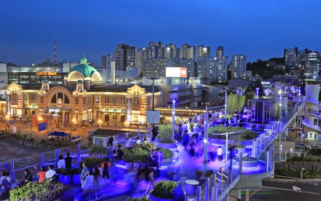 Illuminated roof garden in the city at night